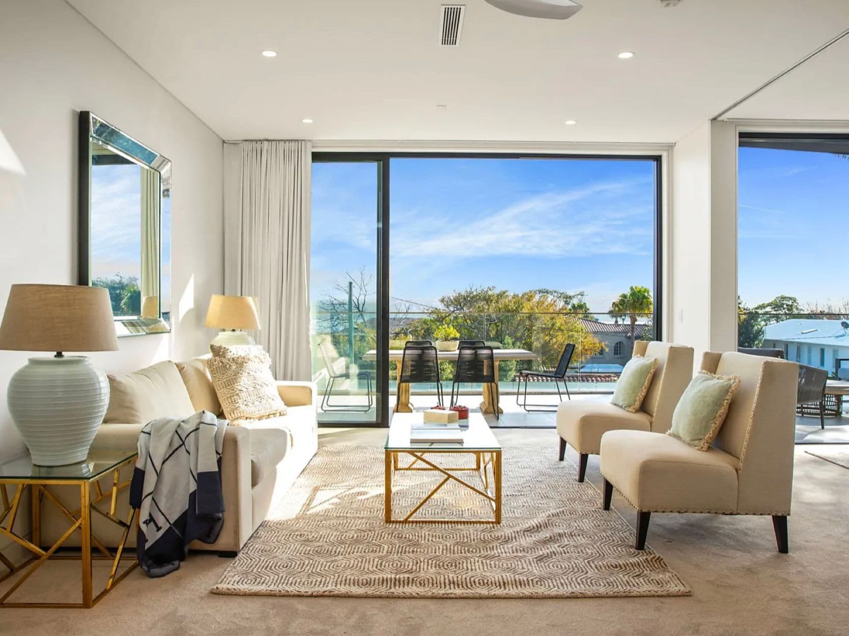 Sheer drapes and sliding glass doors in a Sydney living room with garden views